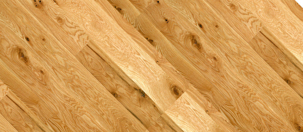 Close-up of a wooden floor featuring the light brown, natural Traditional White Oak finish. Visible grain patterns and knots provide a rustic, warm look, while the wood texture adds depth and character.