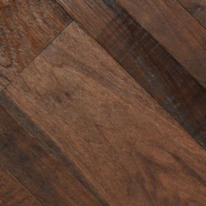 A close-up of a Dark Chocolate wooden floor shows dark chocolate-brown planks arranged diagonally, highlighting the natural grain patterns and subtle color variations for an elegant, rustic look.