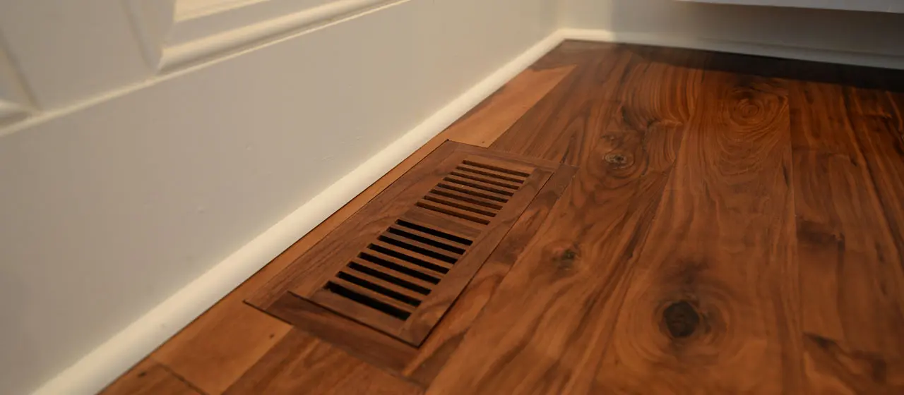 Hardwood floor with wood vent cover