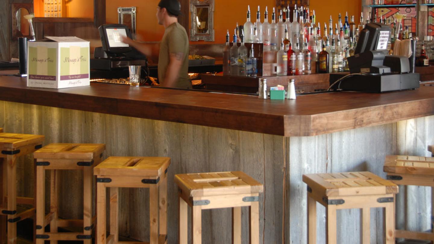 Reclaimed wood bar top in a restaurant/bar.