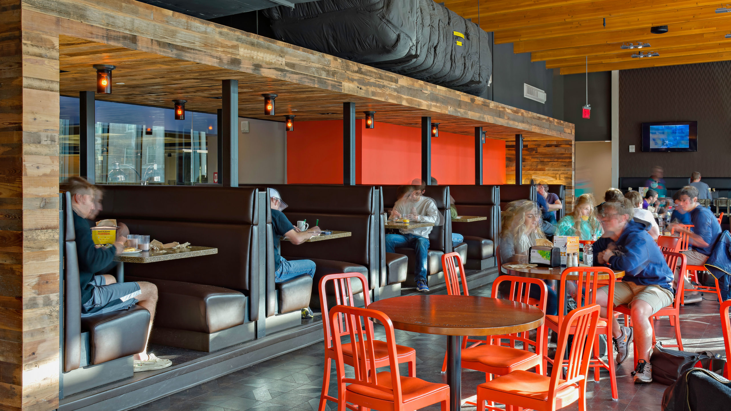 Milled barn wood wall paneling in a restaurant seating area.