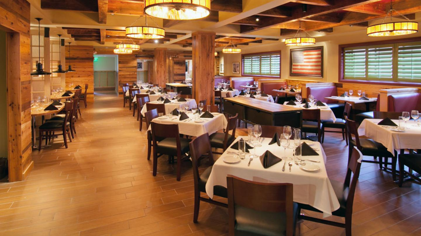 Restaurant dining room utilizing reclaimed hardwood.