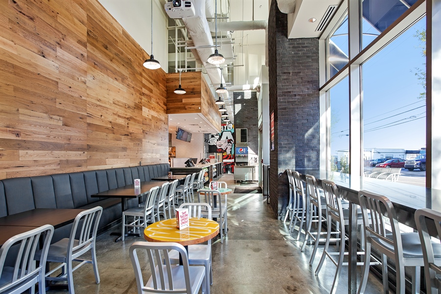 Interior use of oak reclaimed wood wall paneling.