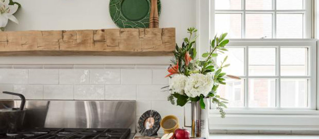 Hand Hewn Mantel Installed as a Shelf Above a Stovetop