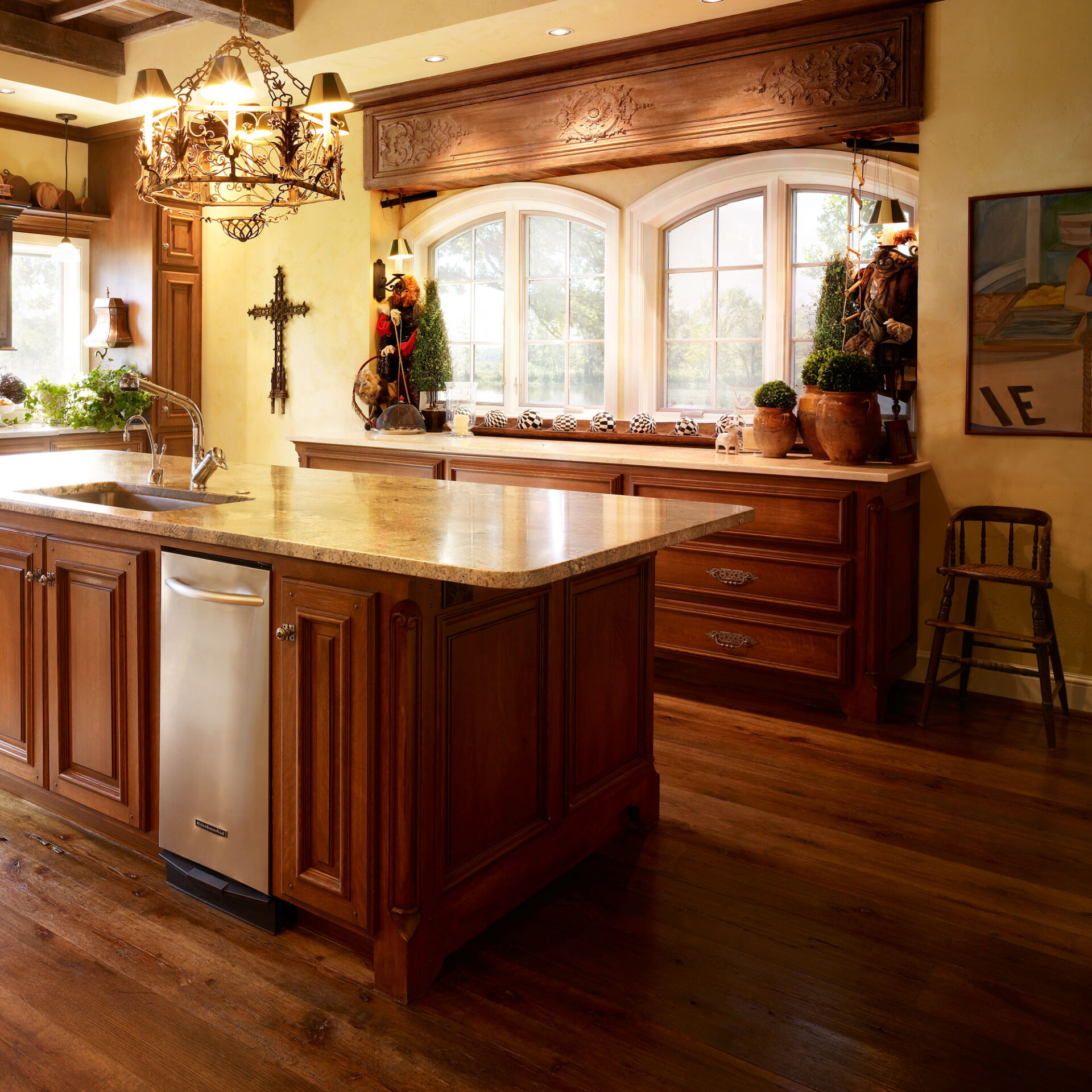 A renovated kitchen that has hardwood flooring