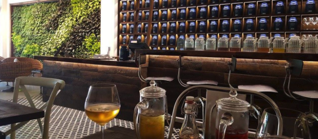 Front of restaurant bar features barn wood paneling.