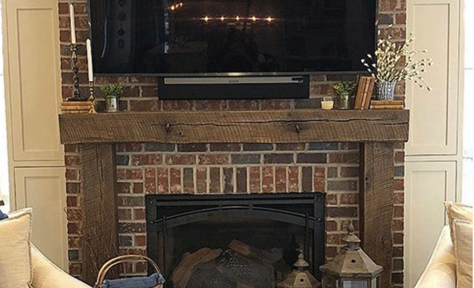 dark wood mantel with brick