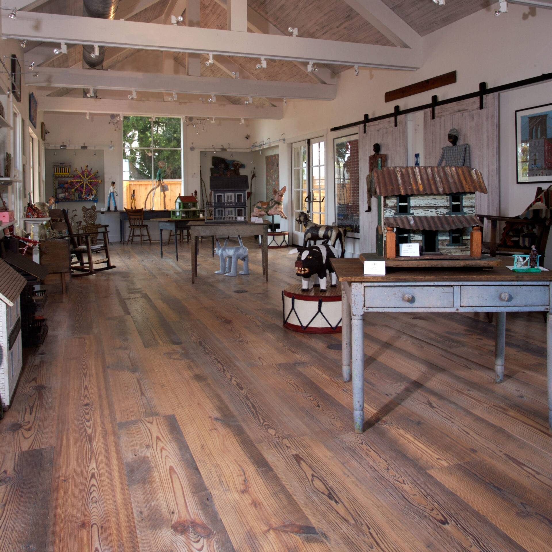 A store that uses wide plank rustic floors with original saw marks