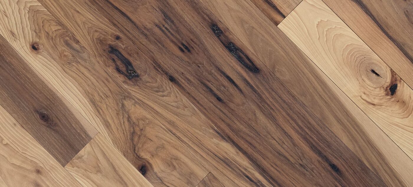 Close-up of "Import placeholder for 25313" flooring shows varied grain patterns and knots in brown tones.